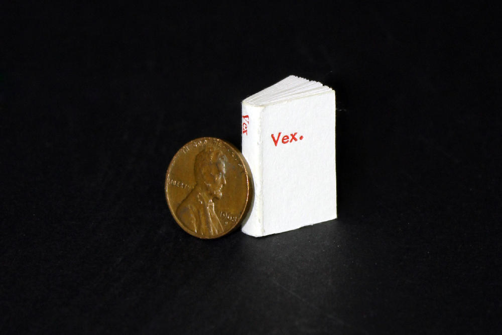 Very small letterpress book, about the size of a penny