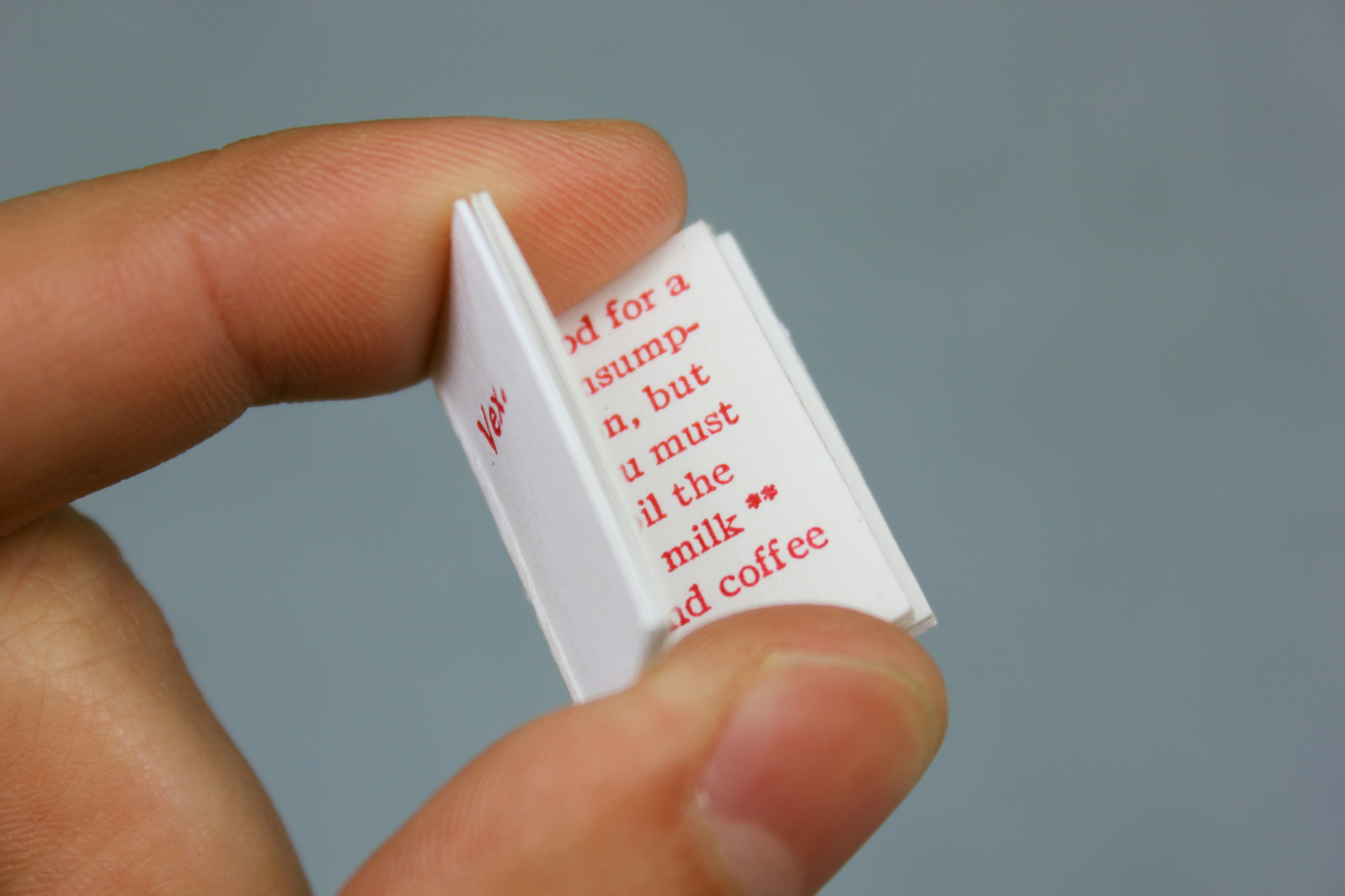 Very small letterpress book, about the size of a penny